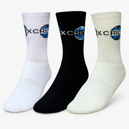 Cricnix sports socks in white, black, and cream with Cricnix branding, displayed on a white background.