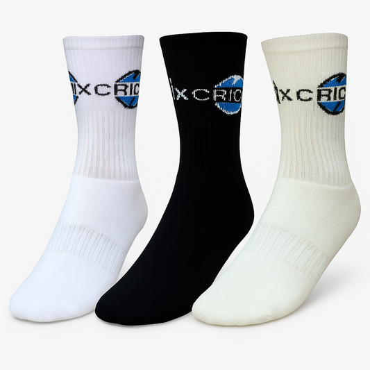 Cricnix sports socks in white, black, and cream with Cricnix branding, displayed on a white background.